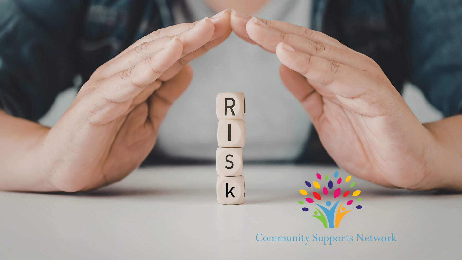 Image of a stack of dice spelling the letters for the word "risk" which is the focus of our blog post about understanding the dignity of risk in disability servicies and delivery of supports for people with special needs.