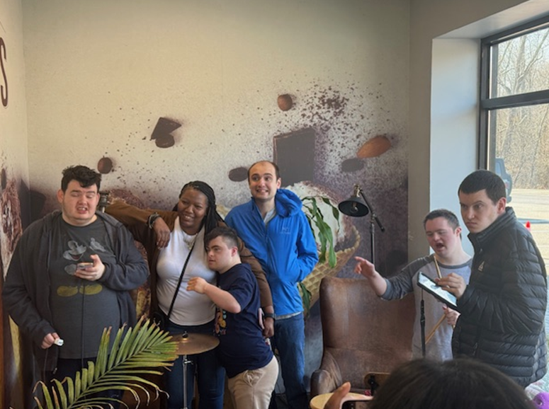 Photo of a group of young adults together in a community of people with special needs.  They are illustrative of what community-based supports really look like, which is the topic of this blog post.