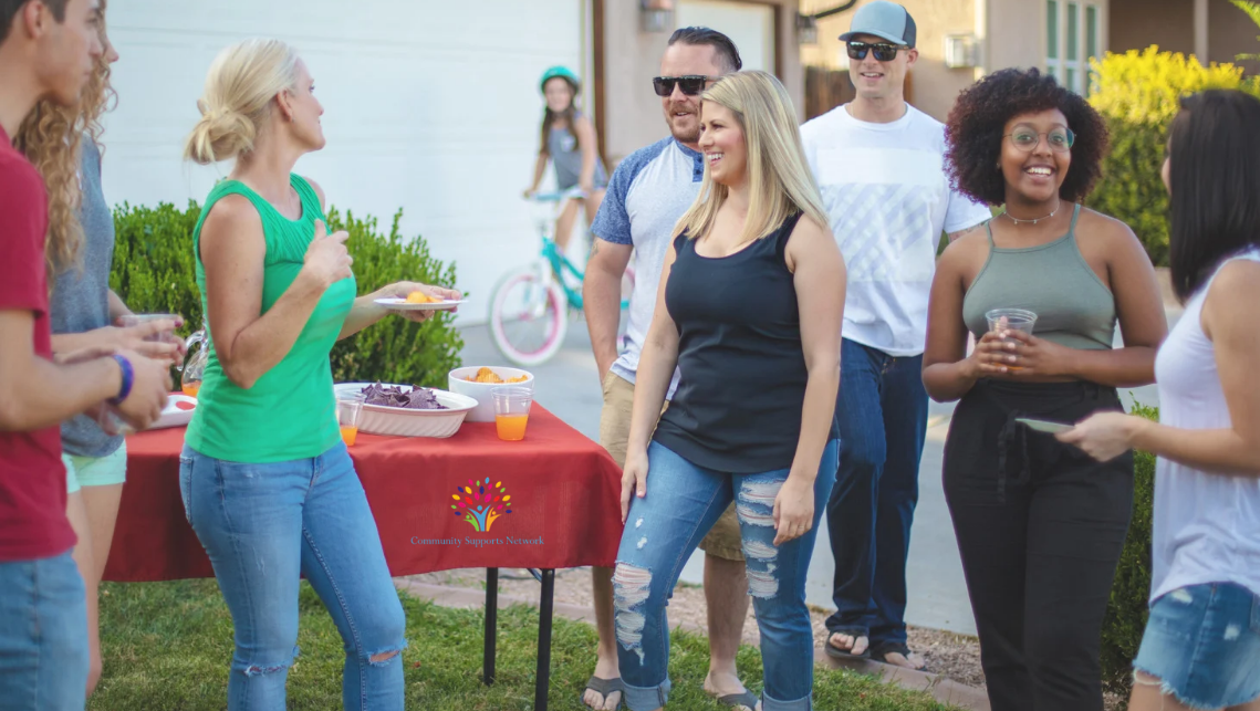 Photo of people enjoying a summertime social event, which are one of the many ways that community activities for DSPs and individuals with disabilities.  Read more about how we see summer in New Jersey as an opportunity to create inclusive events that support people with disabilities and their caregivers connect with each other. 